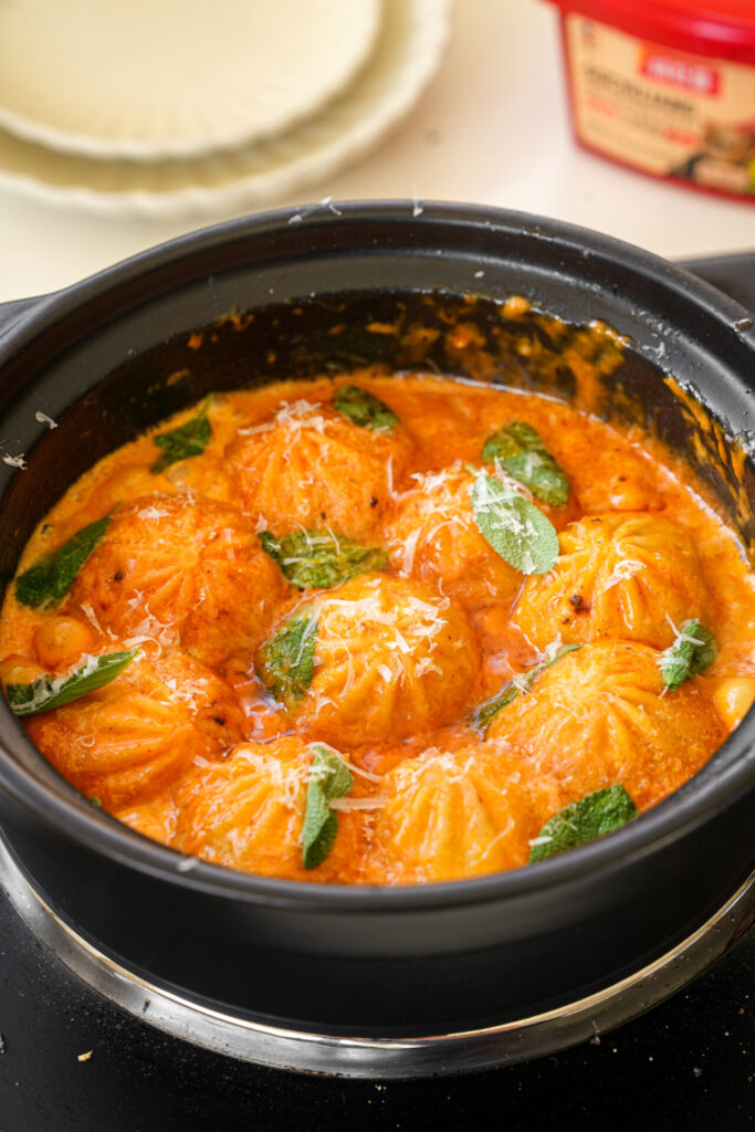 garnish soup dumplings with parmesan cheese and sage