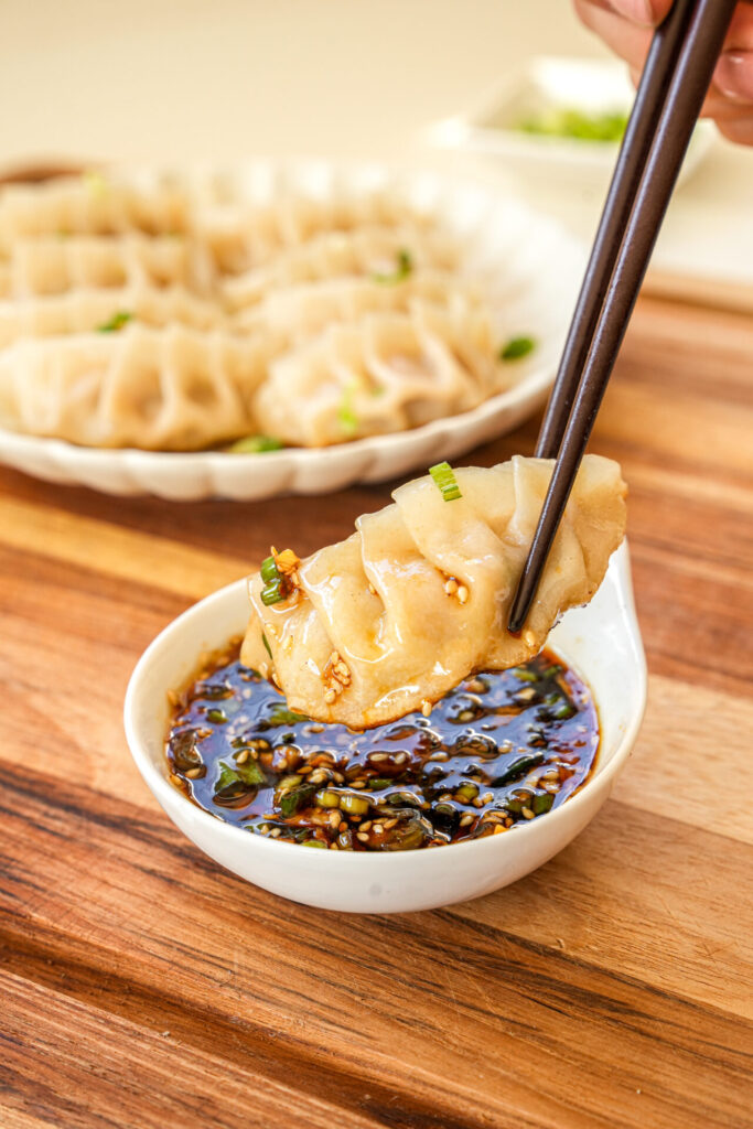 serve pork and cabbage dumplings with dumpling sauce