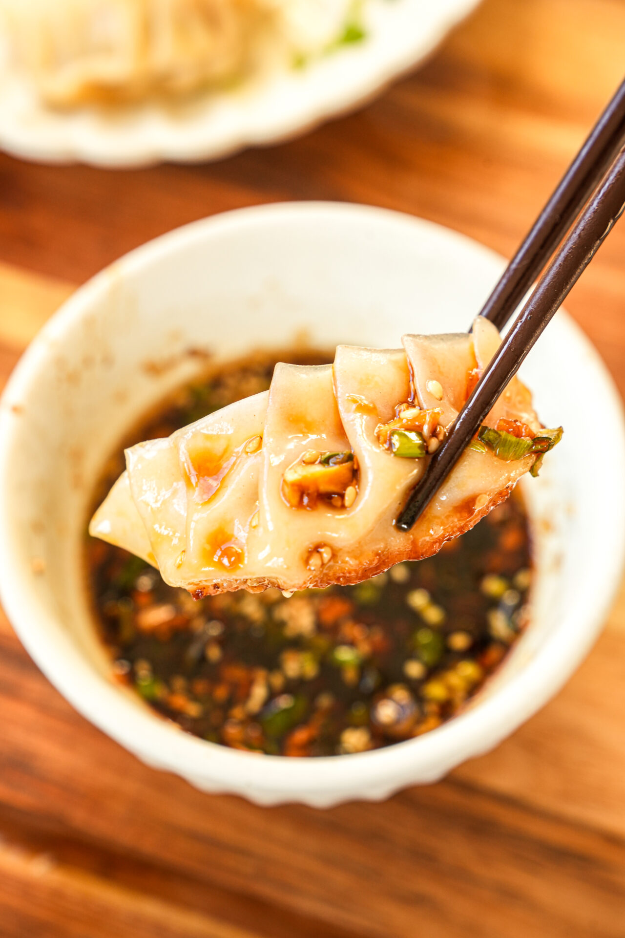 serving pork and cabbage dumplings with dumpling dipping sauce