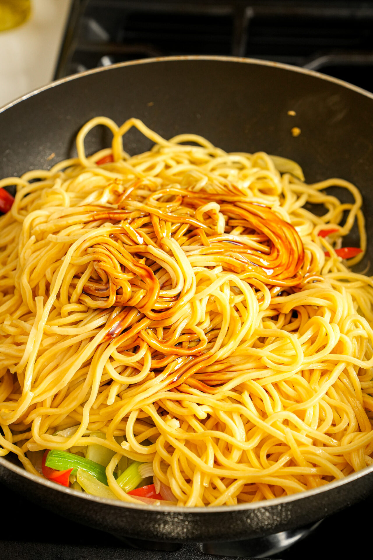 add cooked noodles sauce and seasonings for beef lo mein