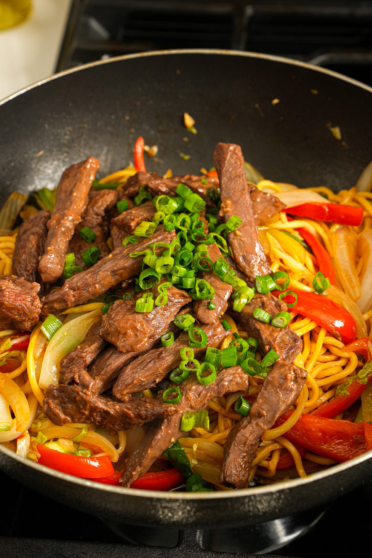 add cooked beef and green onions for beef lo mein