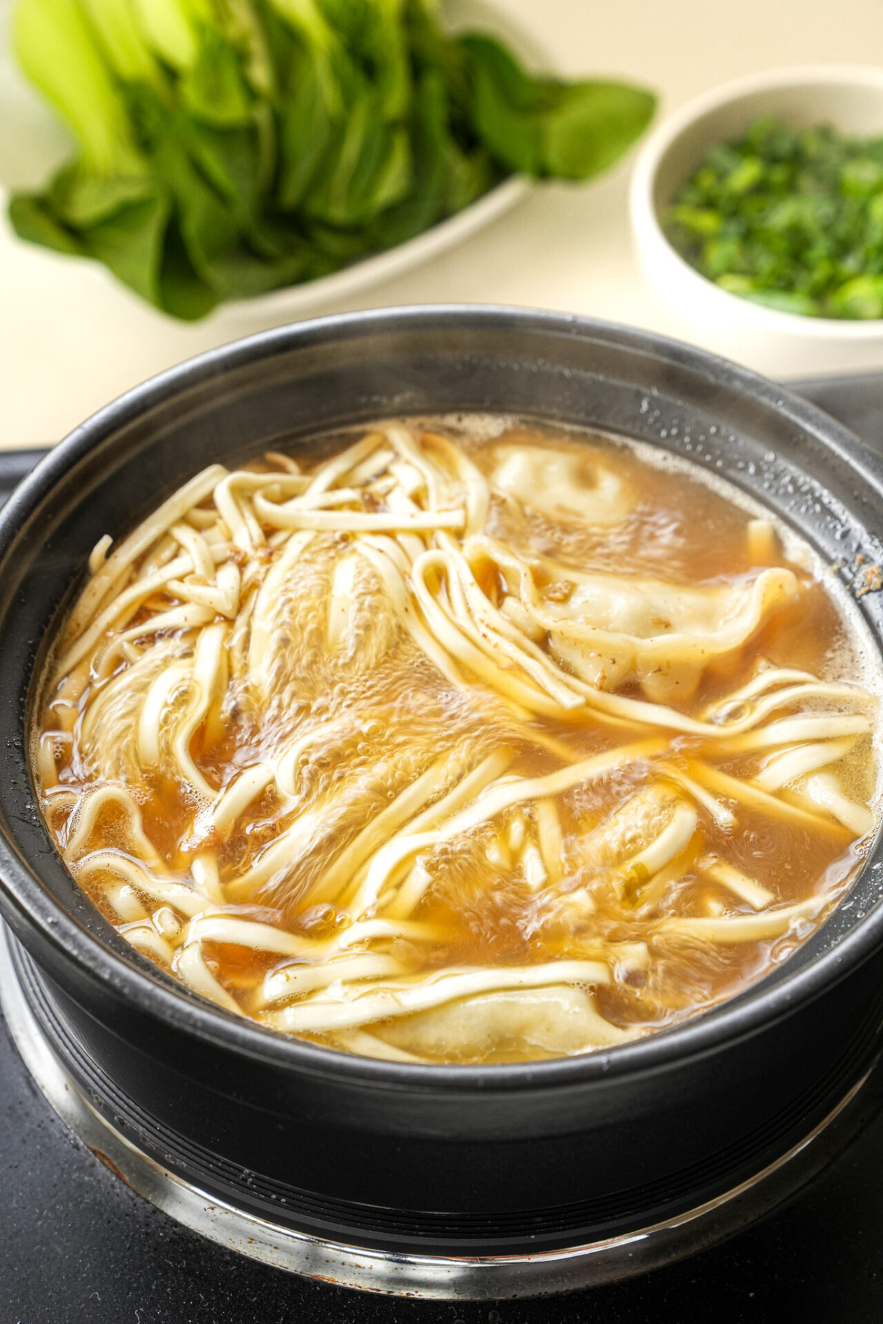 add noodles and dumplings to the boiling water and cook for 6 minutes