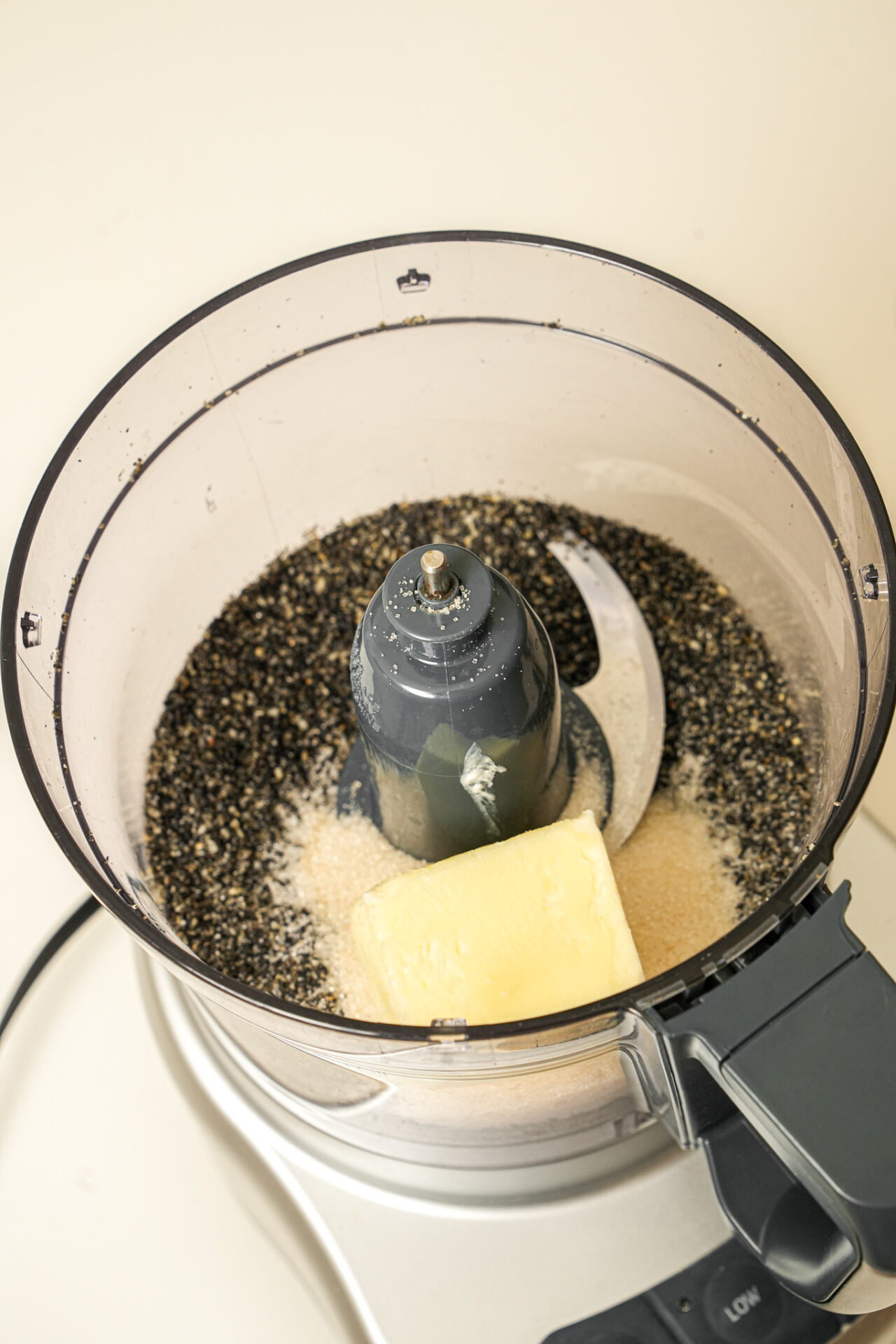 add black sesame seeds, butter, and sugar into a food processor to make black sesame filling