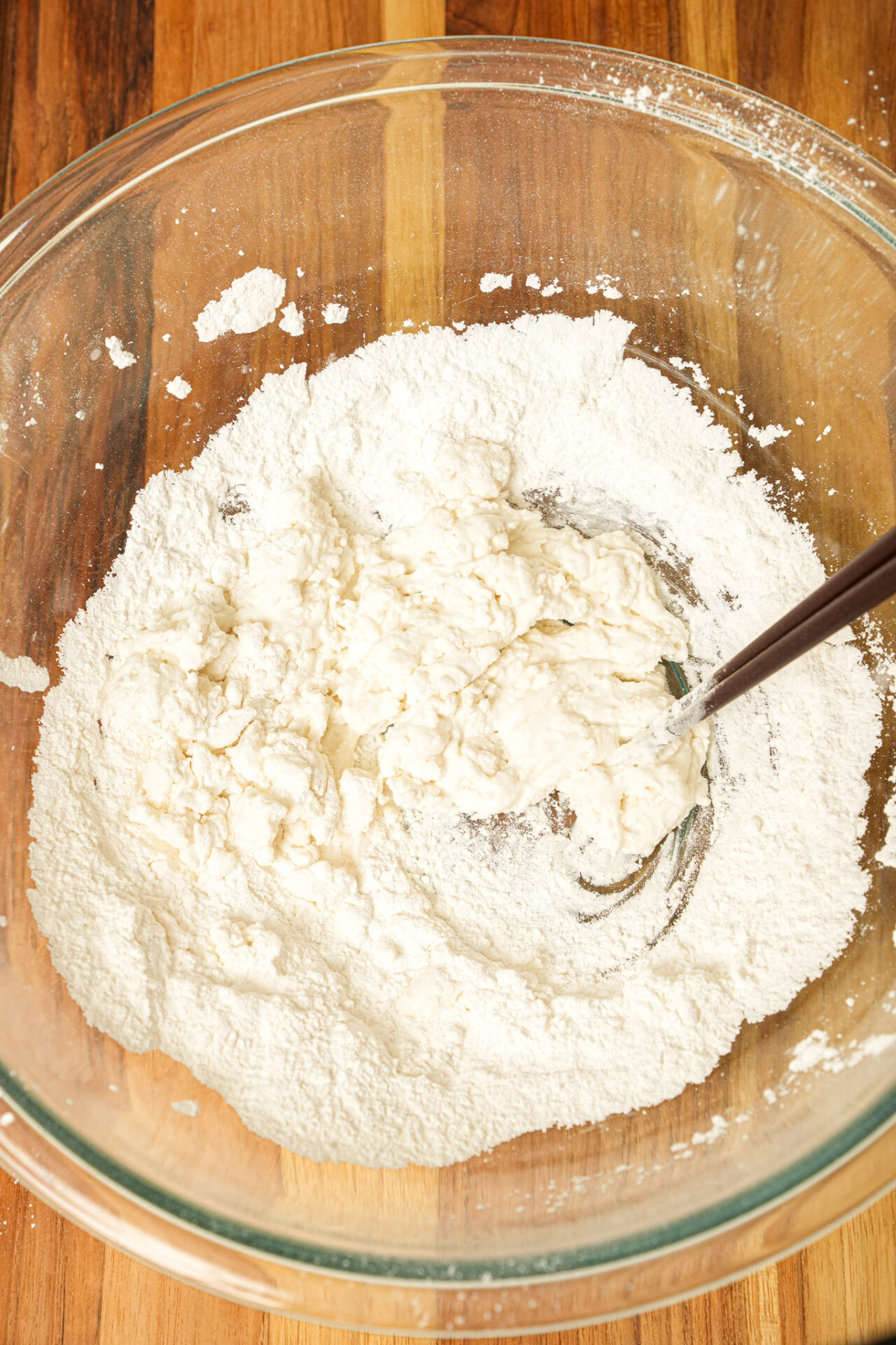 gradually add water to the flour to form a dough to make tang yuan