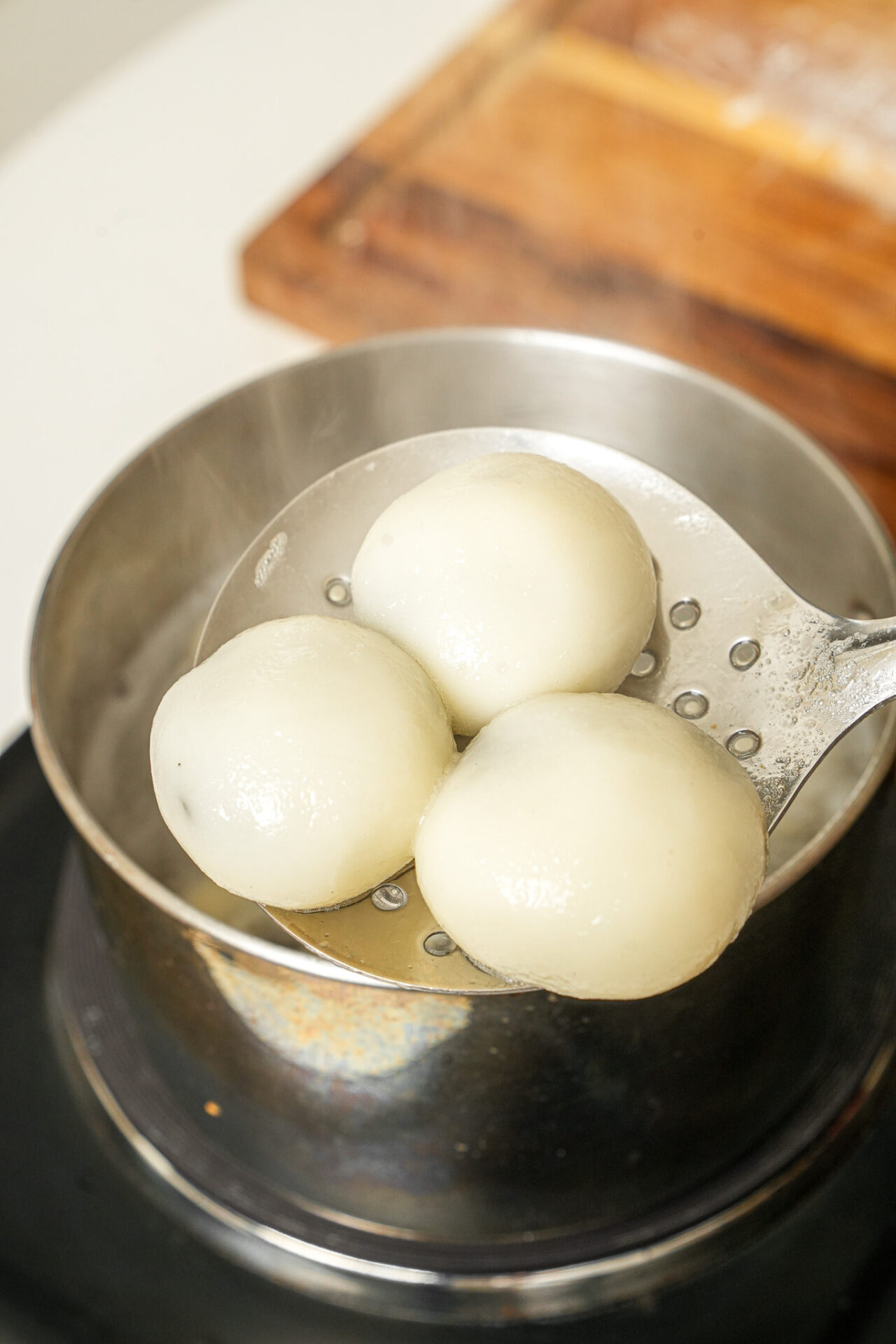 boiling black sesame tang yuan until they float to the top