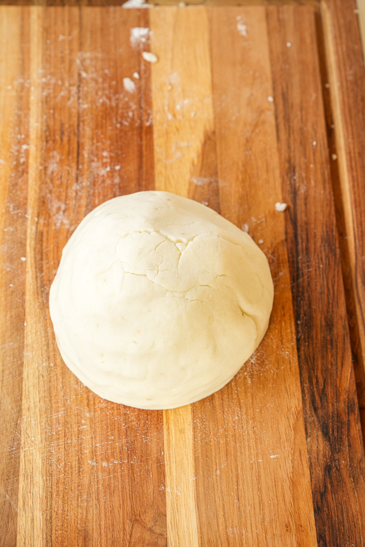 Roll the form the dough into a ball for potato noodles