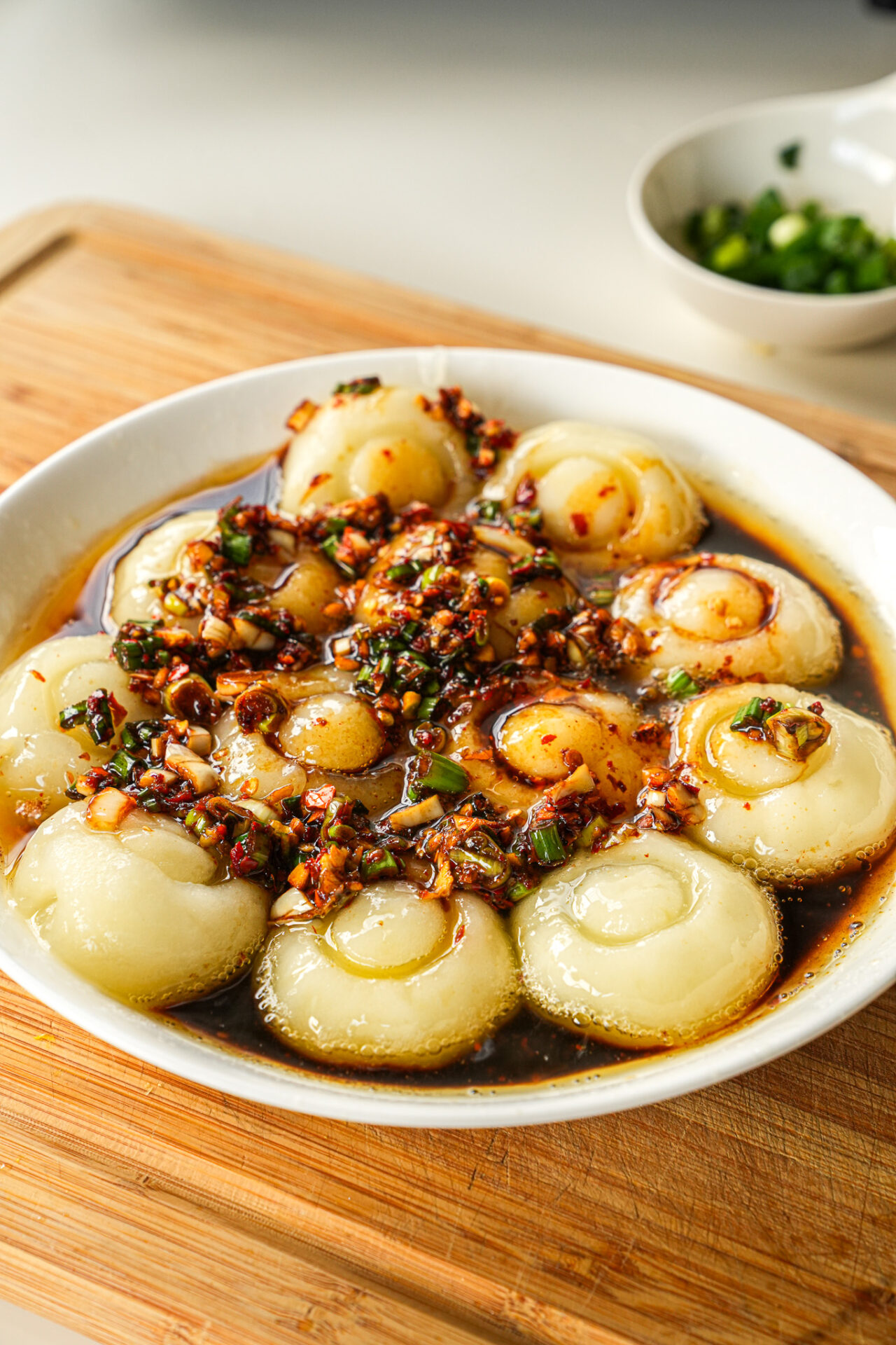 add the sauce and drizzle hot oil to potato noodles