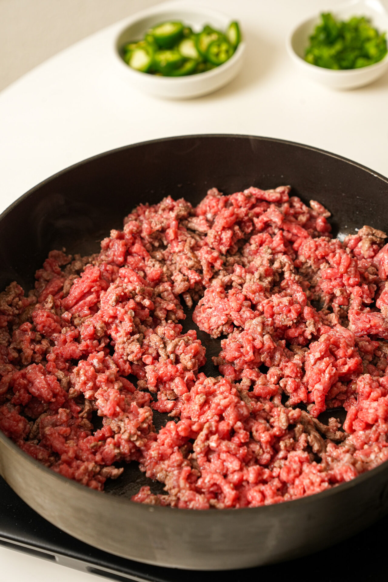 cooking ground beef until brown for mapo tofu nachos