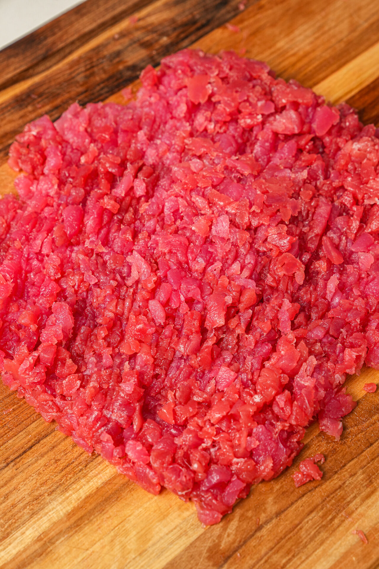 chop sushi-grade tuna for spicy tuna crispy rice into small pieces